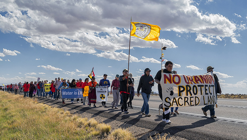 The annual spiritual walk to protest the mill, organized by the White Mesa Concerned Community. The walk travels along Highway 191 from White Mesa to the mill turnoff. TIM PETERSON