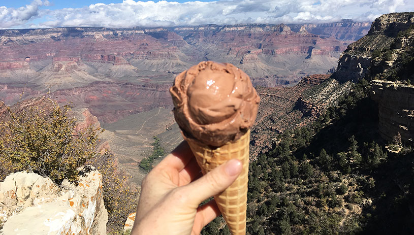 Chocolate ice cream cone with Grand Canyon in background