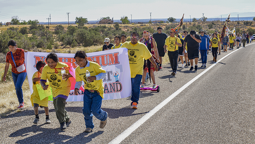 White Mesa community members lead the spiritual walk to protest the White Mesa Mill. TIM PETERSON