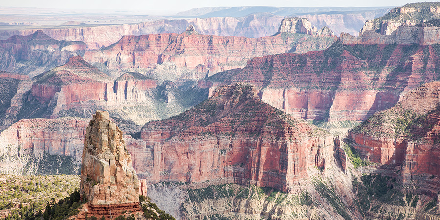 Red rock layers in the Grand Canyon fading out to the horizon.