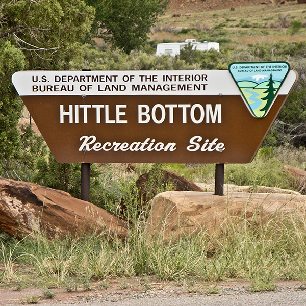 A brown sign at Hittle Bottom Campground that says "Hittle Bottom Recreation site"