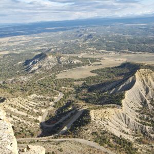 A view of the Mancos Valley from Point Lookout, including the park road and shale hills