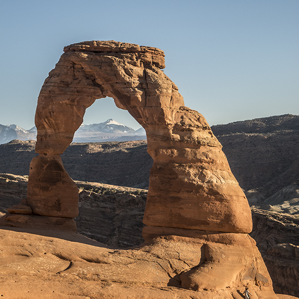 Delicate Arch with the La Sal Mountains peeking through it's window.