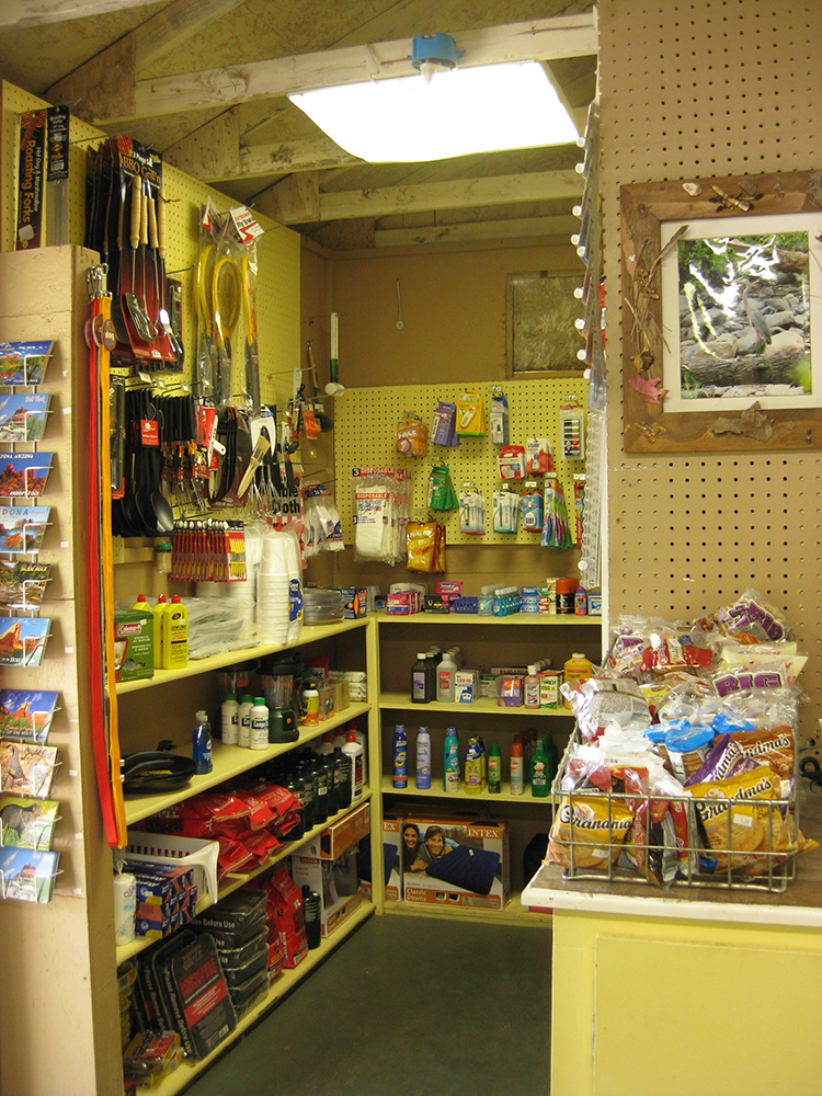 A little campground store with three stocked shelves