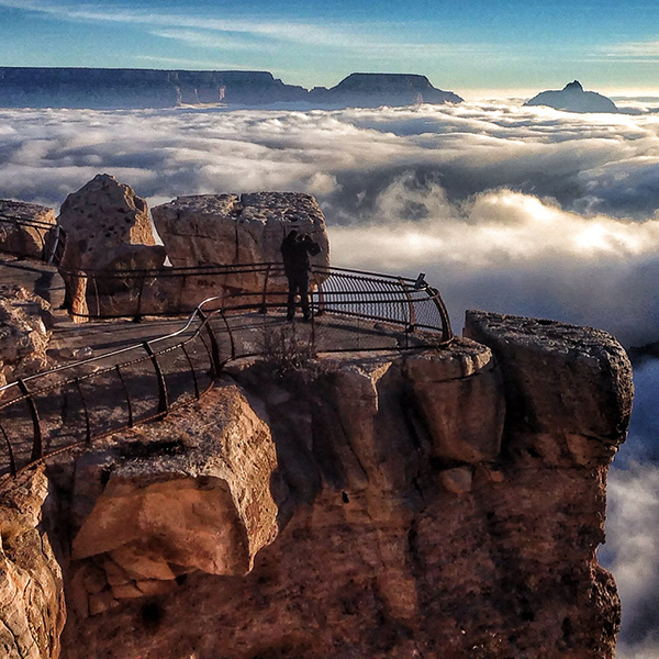 The grand canyon filled with clouds during an inversion, the edge of the canyon looks like a beach in front of a sea of clouds