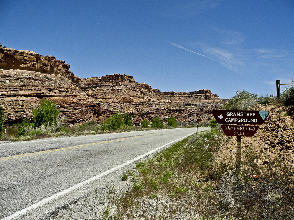 A view of GrandStaff Campground from the river road, with cliffs on the opposite side of the Colorado River