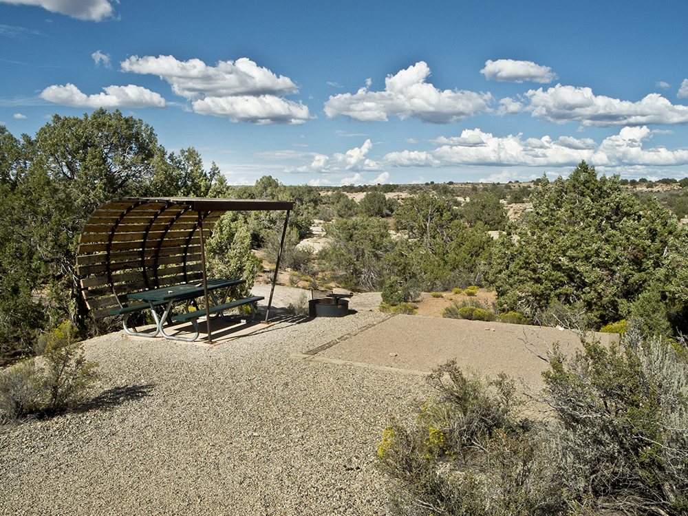 A campsite with blue skies and clouds