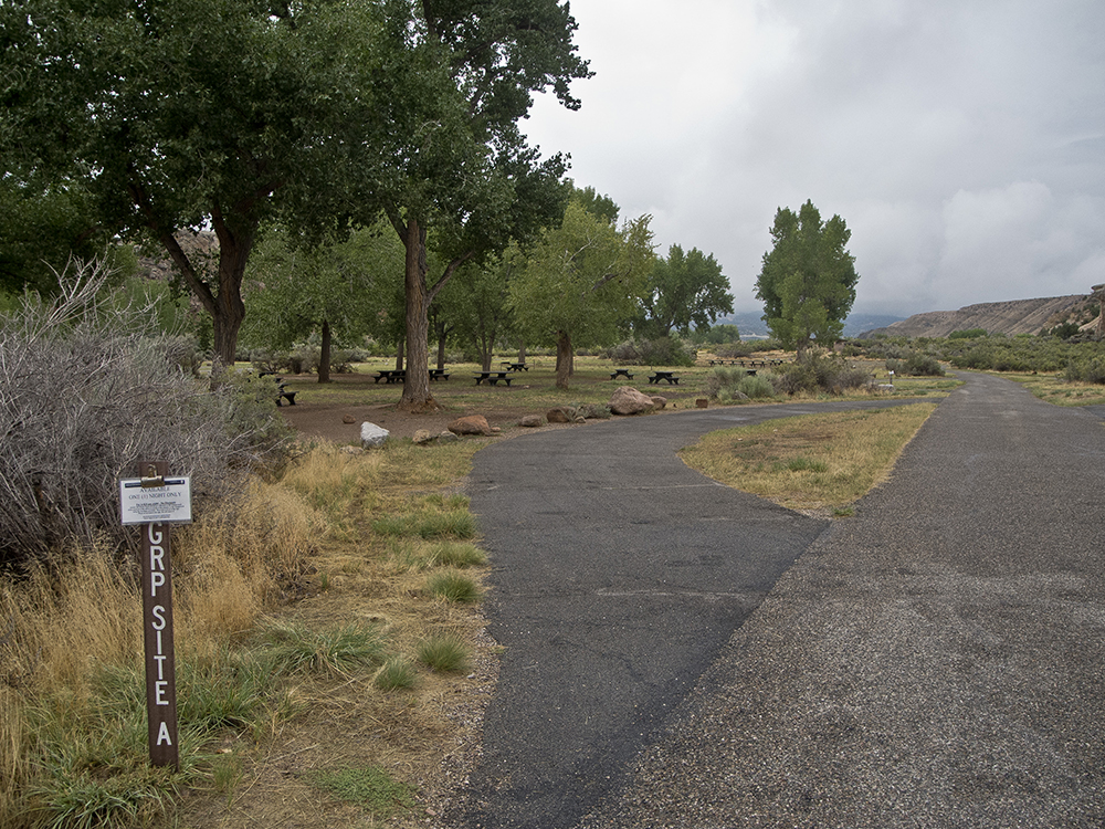 A paved road leading to a campsite