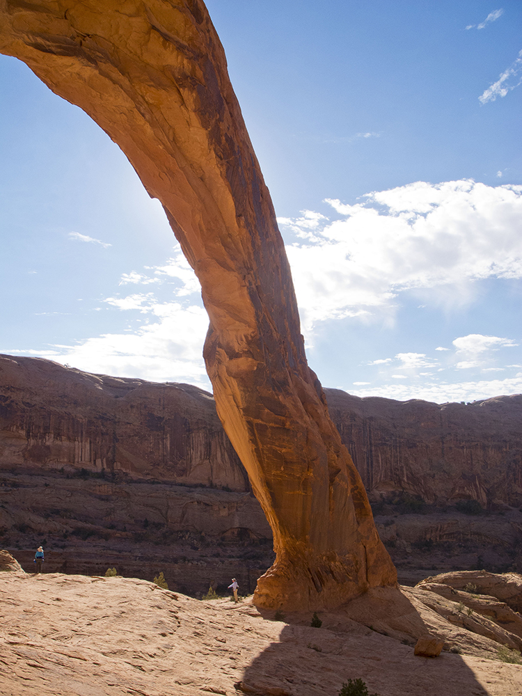 One of the ends of Corona Arch, with cliffs behind