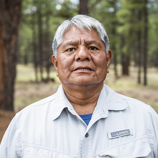 Richard Powskey, Hualapai, in a collared shirt with grey hair. Powskey is an advocate for Native Voices at the Grand Canyon