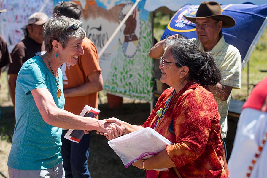 Interior secretary Sally Jewel shakes hands with Save the Confluence leader Renae Yellowhorse in 2016