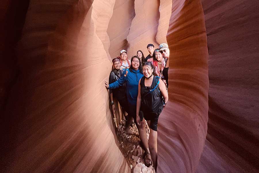 Leadershift students in a red rock slot canyon