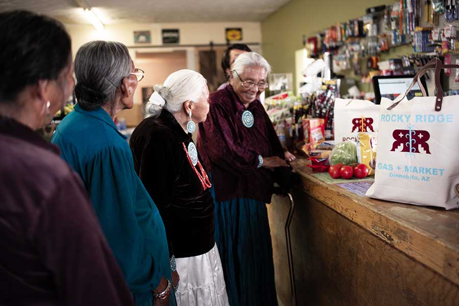 Customers stand in line at the Native-owned small business Rocky Ridge Market on the Navajo Nation