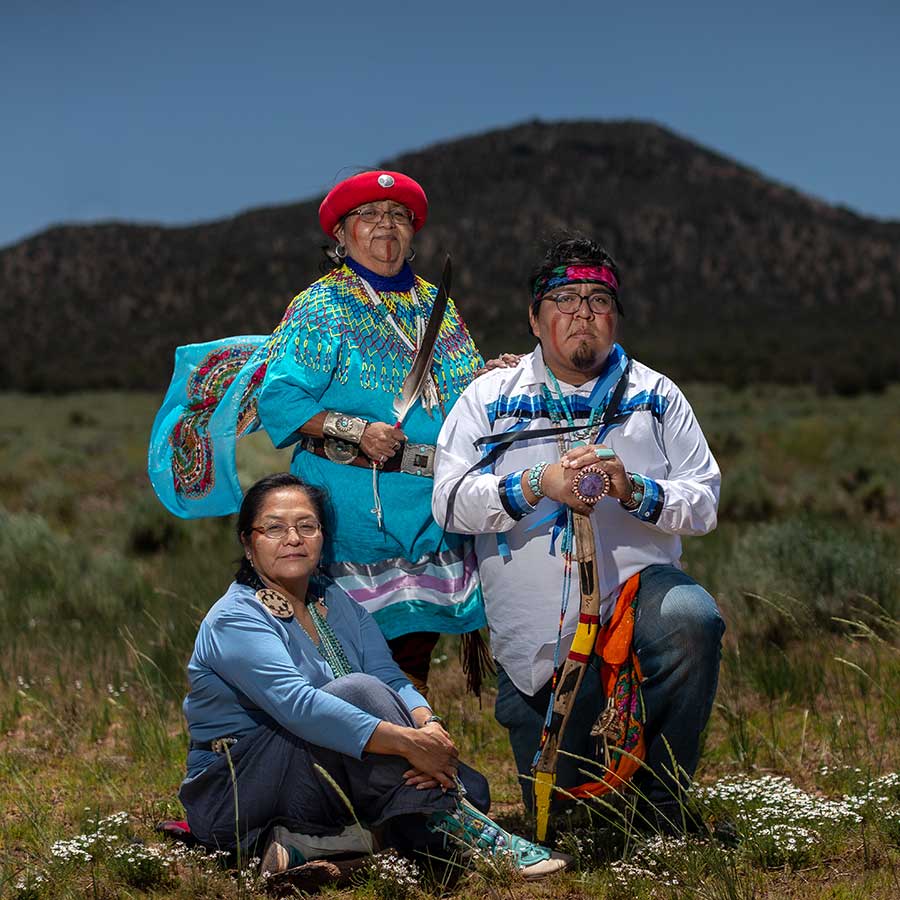 Carletta Tilousi, Stuart Chavez, and Dianna Sue White Dove Uqualla of the Havasupai Tribe in traditional dress in front of Red Butte, in Baaj Nwaavjo I'tah Kukveni - Ancestral Footprints of the Grand Canyon National Monument