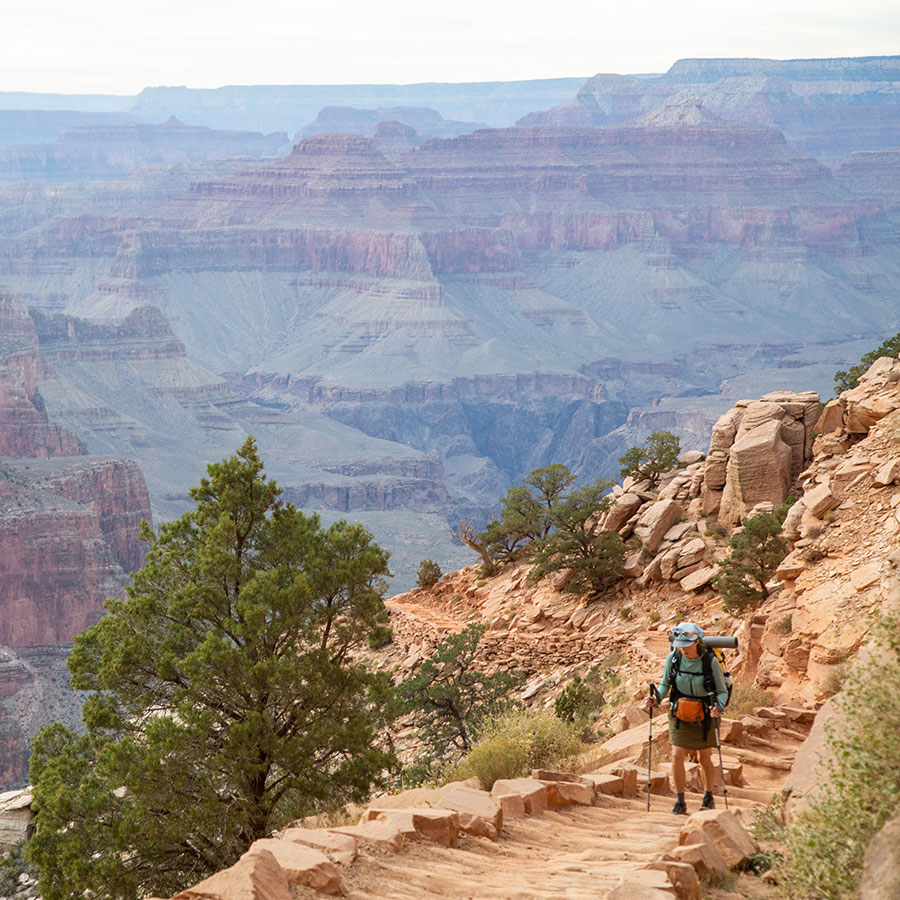 A hiker on Bright Angel Trail in Grand Canyon National Park.